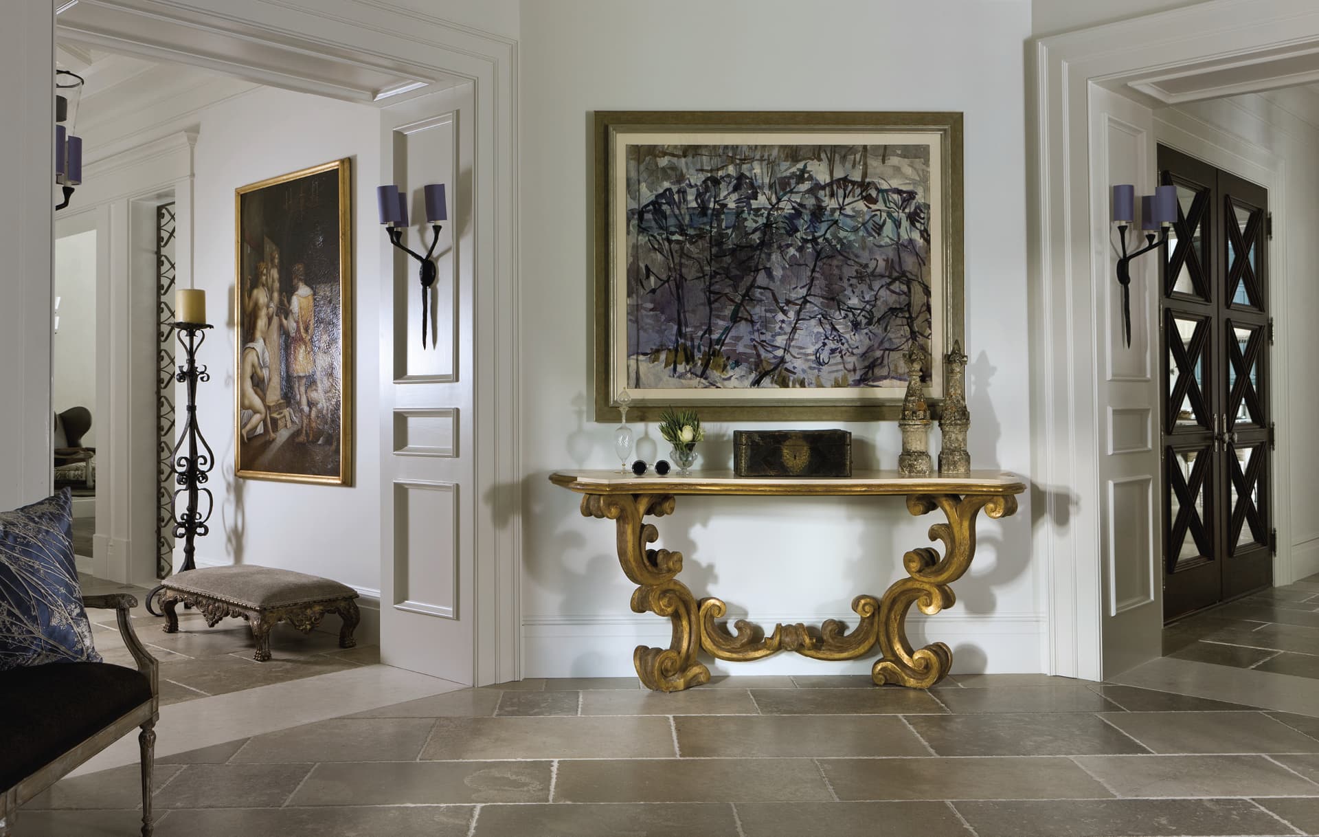 Entryway with ornate table and abstract painting