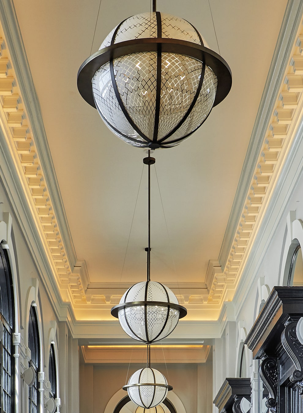 Spherical light fixtures in a hallway